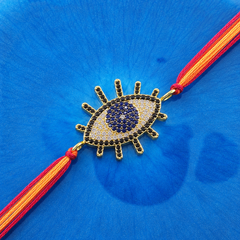 Designer Evil Eye Gold Plated CZ Red Orange Thread Rakhi For Men