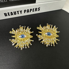Beaten Finish Big Eyelash Evil Eye Baguette Cubic Zirconia 18 Gold Stud Earring For Women