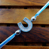Horse Shoe Silver Sky Blue American Diamond Crystal Thread Rakhi