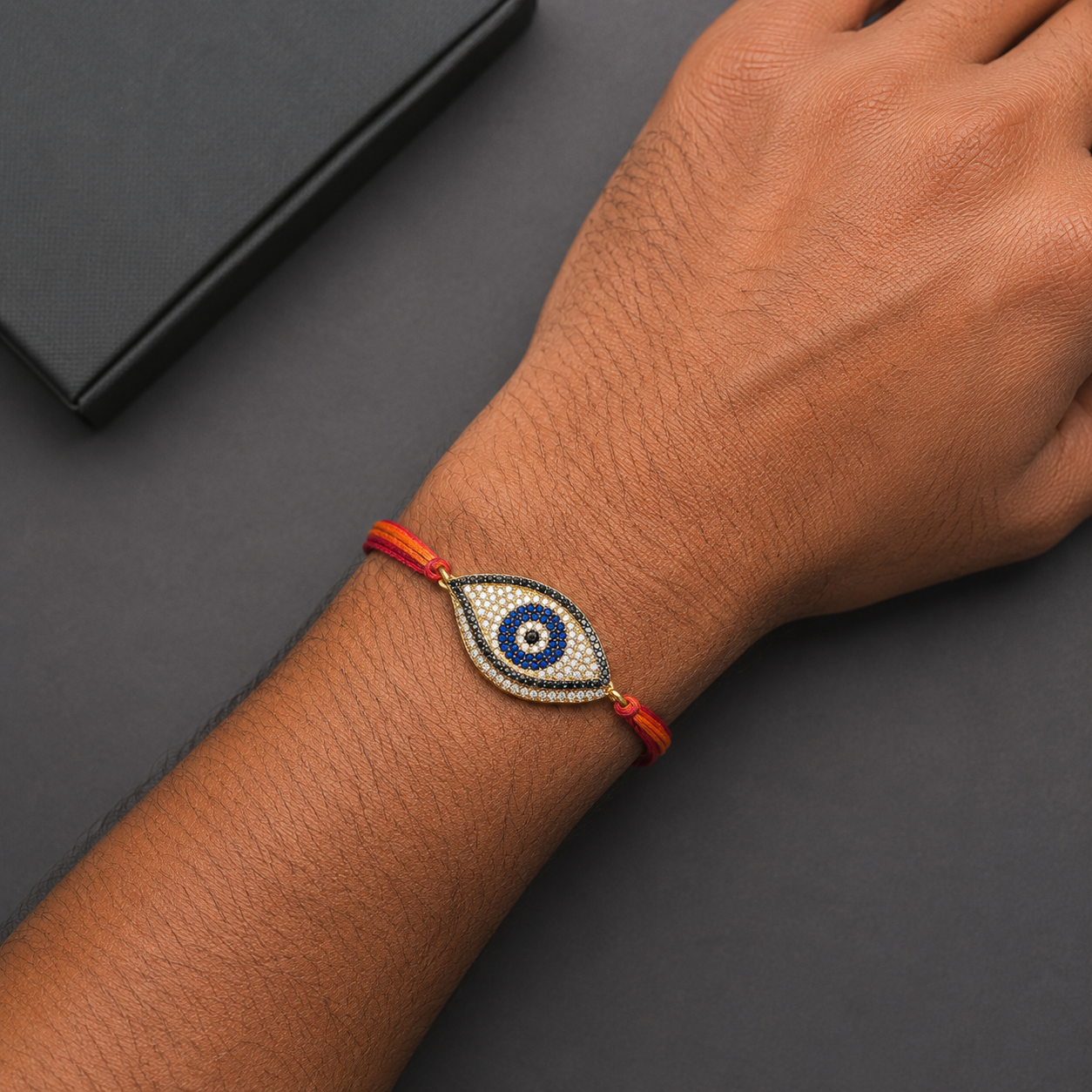Designer Oval Evil Eye Black CZ Red Orange Thread Rakhi For Men