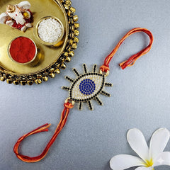 Designer Evil Eye Gold Plated CZ Red Orange Thread Rakhi For Men