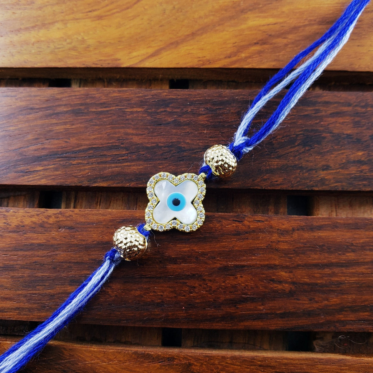 Flower Evil Eye Gold Cubic Zirconia Thread Rakhi For Men