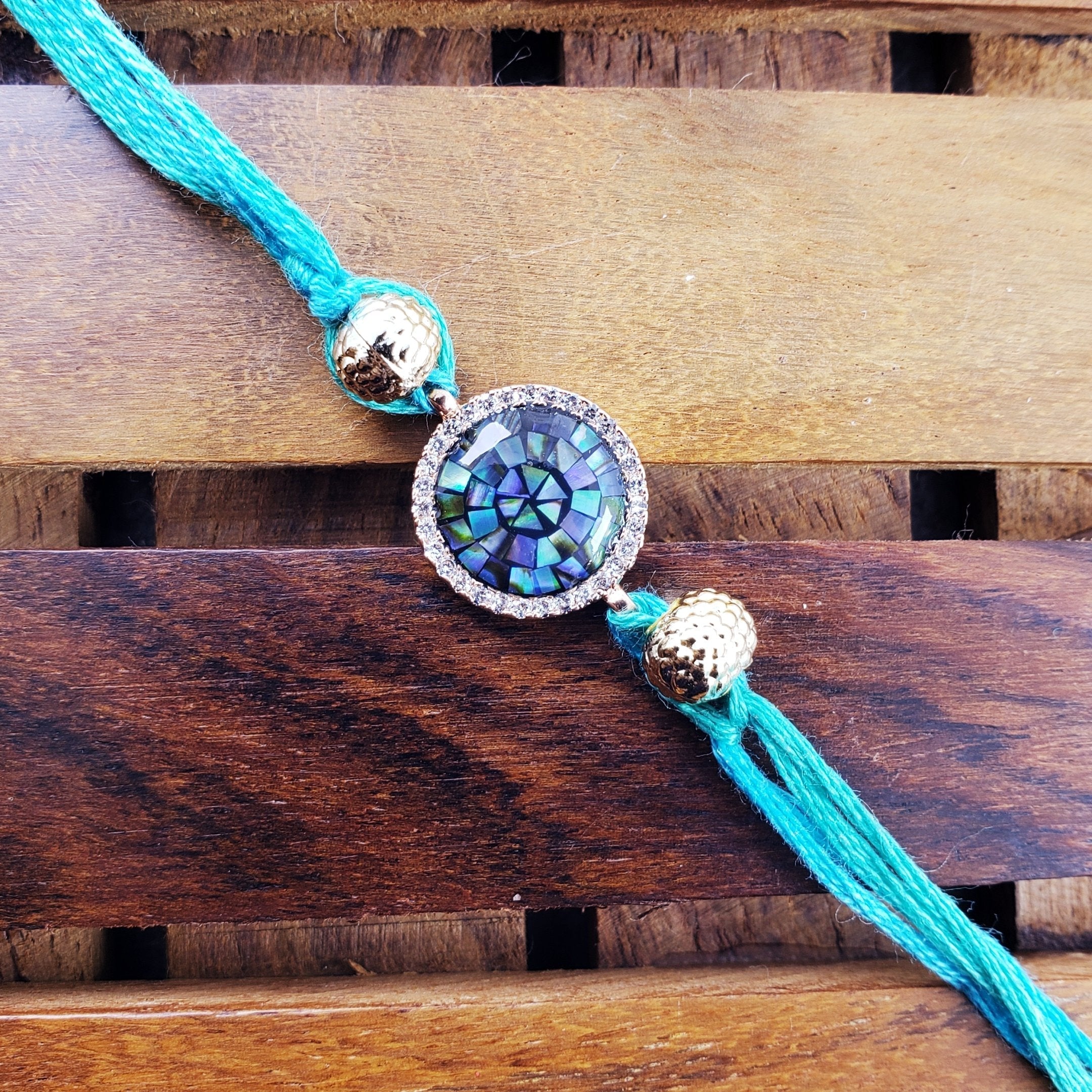 Round Rakhi Gold Round American Diamond Gold Blue Thread Rakhi For Men – ZIVOM