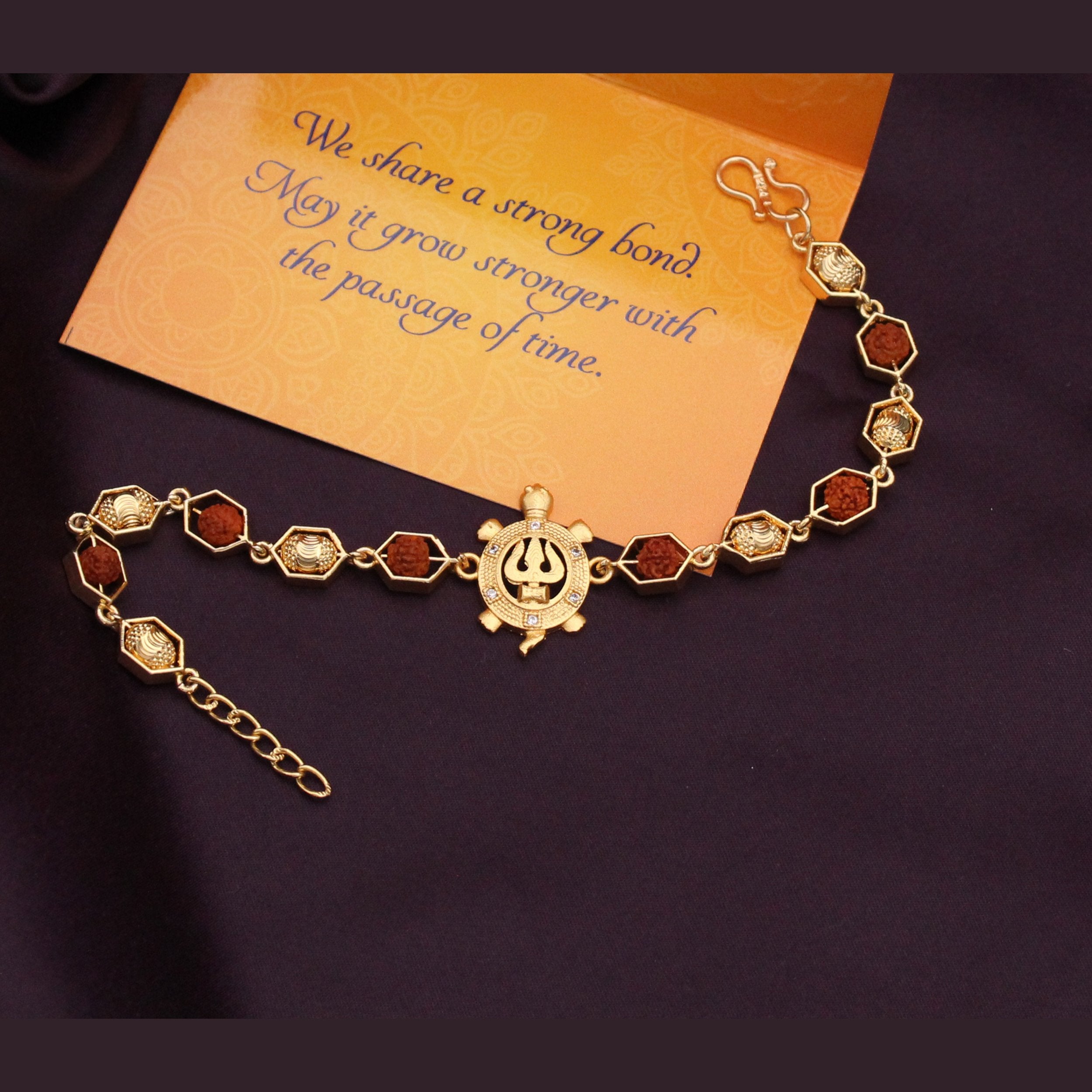 Blessingful Damru rudraksh Gold plated shiva Bracelet Rakhi for Brother   Buy Online Designer Rakhi