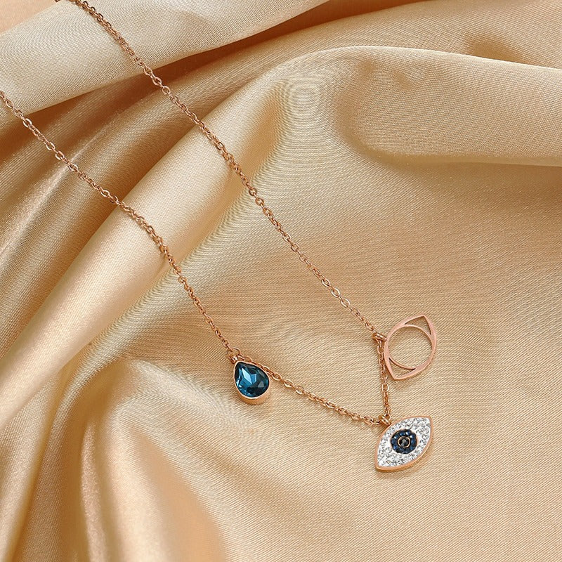 Jewelili Twisted Shape Teardrop Pendant Necklace with Created Blue Sapphire  and Created White Sapphire in Sterling Silver